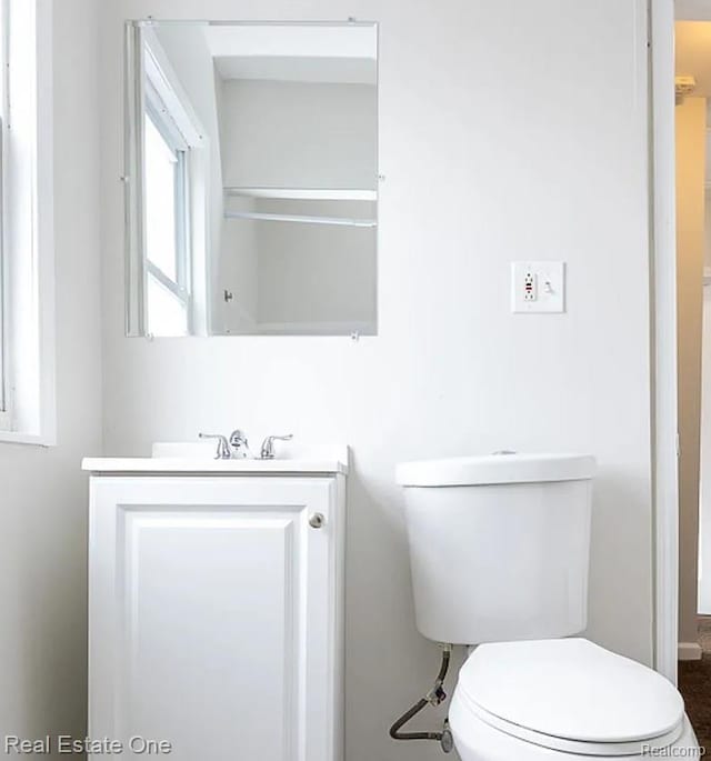 15827 Tracey St, Detroit, MI 48227 - bathroom featuring vanity, toilet, and baseboards