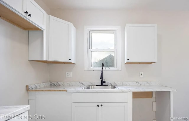 15827 Tracey St, Detroit, MI 48227 - kitchen with a sink, white cabinetry, and light countertops