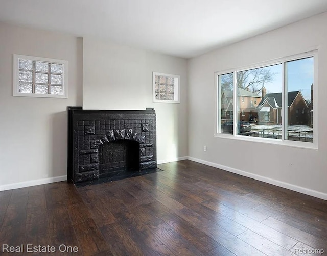 15827 Tracey St, Detroit, MI 48227 - unfurnished living room with hardwood / wood-style flooring, a tile fireplace, and baseboards