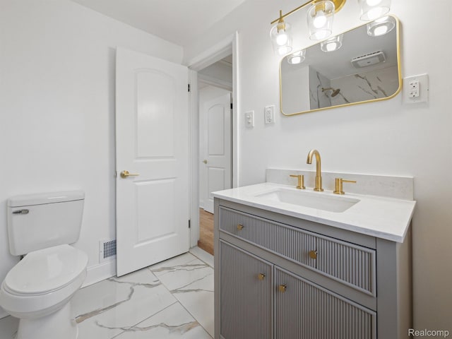 18212 Sorrento St, Detroit, MI 48235 - bathroom featuring marble look tile flooring, vanity, toilet, and baseboards