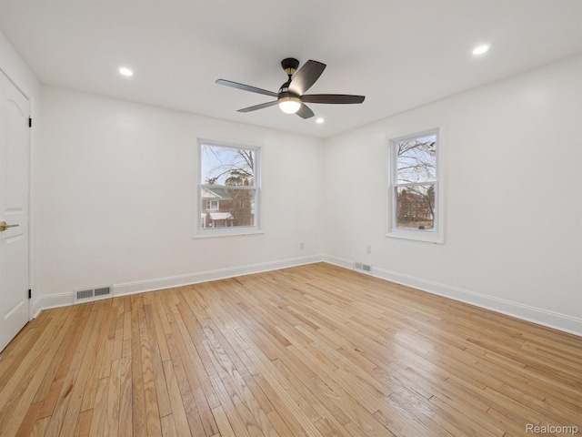 18212 Sorrento St, Detroit, MI 48235 - empty room with healthy amount of natural light, light wood-style floors, a ceiling fan, and recessed lighting