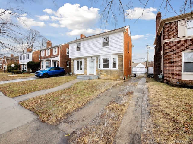 18212 Sorrento St, Detroit, MI 48235 - multi unit property featuring a chimney and stone siding