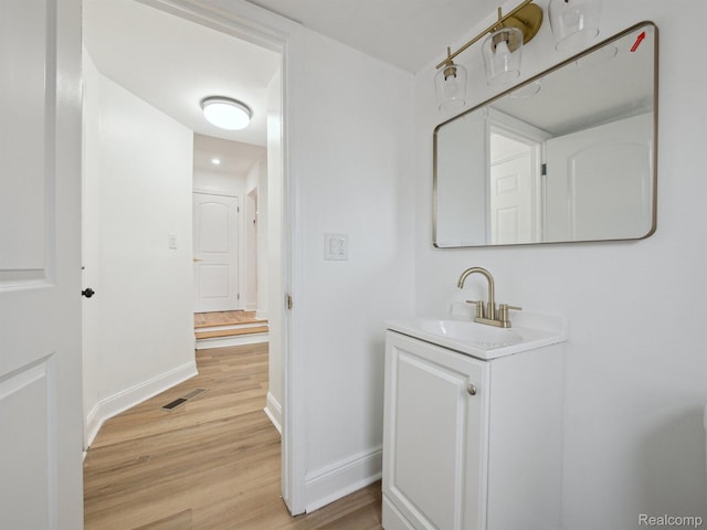 18212 Sorrento St, Detroit, MI 48235 - bathroom featuring wood finished floors, vanity, and baseboards
