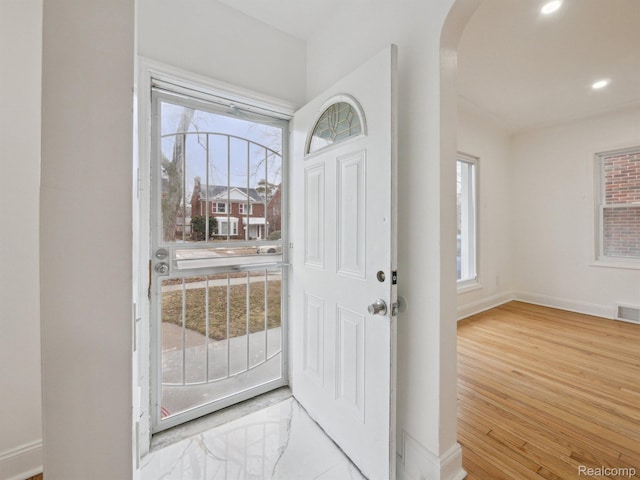 18212 Sorrento St, Detroit, MI 48235 - foyer entrance with arched walkways, healthy amount of natural light, wood finished floors, baseboards, and recessed lighting