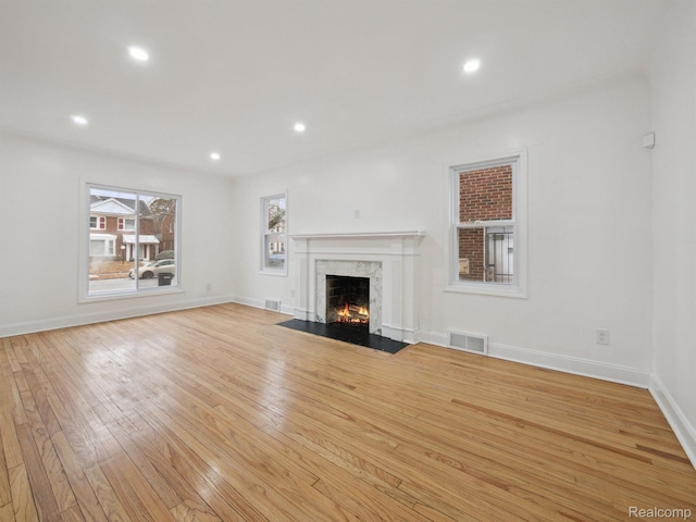 18212 Sorrento St, Detroit, MI 48235 - unfurnished living room with a fireplace, light wood-type flooring, recessed lighting, and baseboards