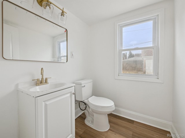 18212 Sorrento St, Detroit, MI 48235 - bathroom with vanity, wood finished floors, toilet, and baseboards