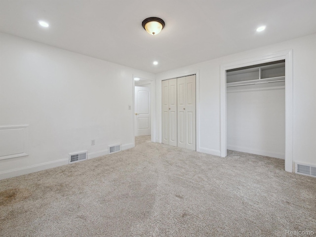 18212 Sorrento St, Detroit, MI 48235 - unfurnished bedroom featuring two closets, carpet, recessed lighting, and baseboards