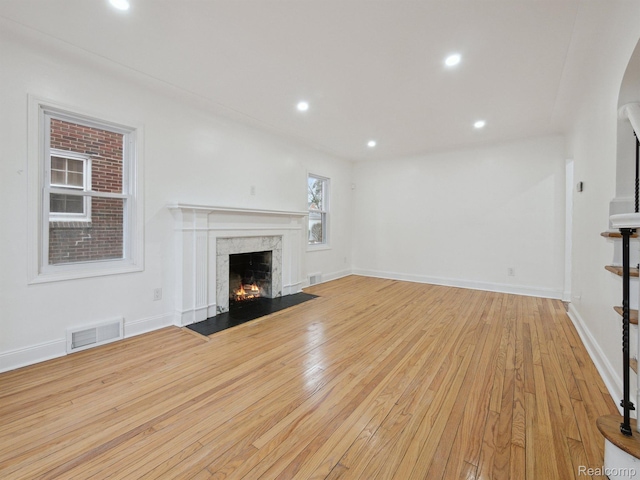18212 Sorrento St, Detroit, MI 48235 - unfurnished living room with a fireplace, light wood-style flooring, recessed lighting, and baseboards
