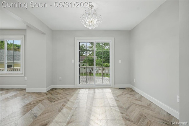 3004 Lansdowne Rd, Waterford, MI 48329 - unfurnished room with a chandelier, plenty of natural light, and baseboards
