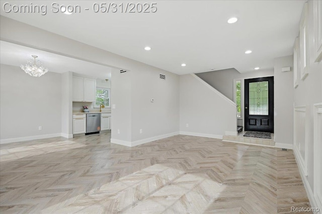 3004 Lansdowne Rd, Waterford, MI 48329 - unfurnished living room featuring a chandelier, recessed lighting, and baseboards