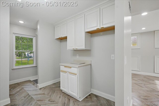 3004 Lansdowne Rd, Waterford, MI 48329 - kitchen with white cabinetry, baseboards, light countertops, and recessed lighting
