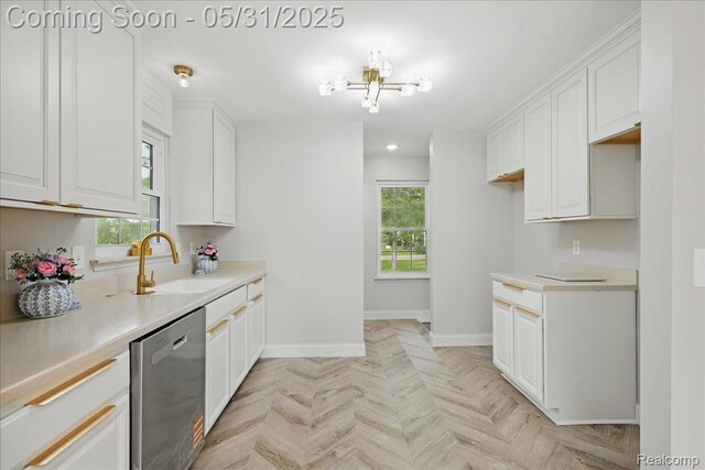 3004 Lansdowne Rd, Waterford, MI 48329 - kitchen featuring dishwasher, a sink, baseboards, a chandelier, and white cabinetry