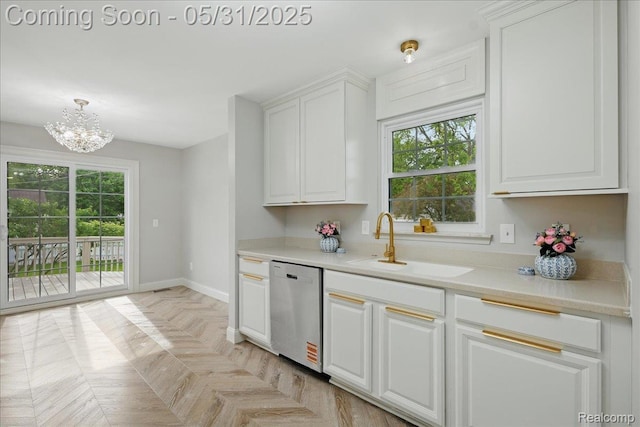 3004 Lansdowne Rd, Waterford, MI 48329 - kitchen with stainless steel dishwasher, a sink, a chandelier, and plenty of natural light