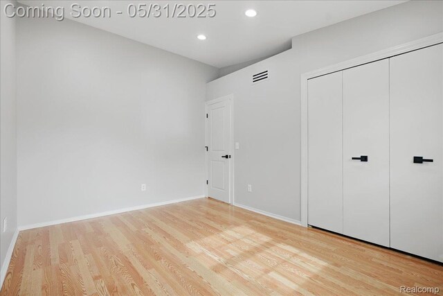 3004 Lansdowne Rd, Waterford, MI 48329 - unfurnished bedroom with wood finished floors, recessed lighting, baseboards, and a closet