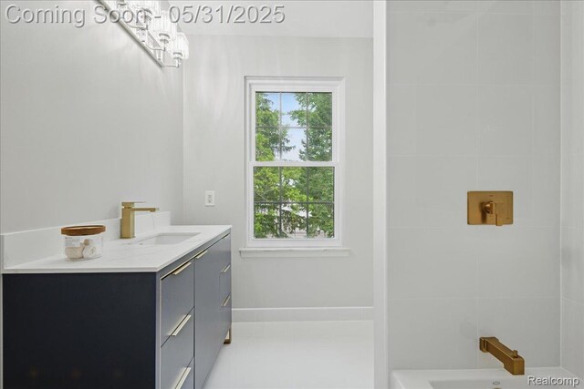 3004 Lansdowne Rd, Waterford, MI 48329 - full bath with healthy amount of natural light, vanity, a chandelier, and baseboards