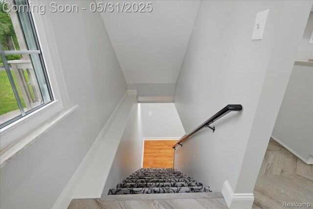 3004 Lansdowne Rd, Waterford, MI 48329 - stairs with baseboards and wood finished floors