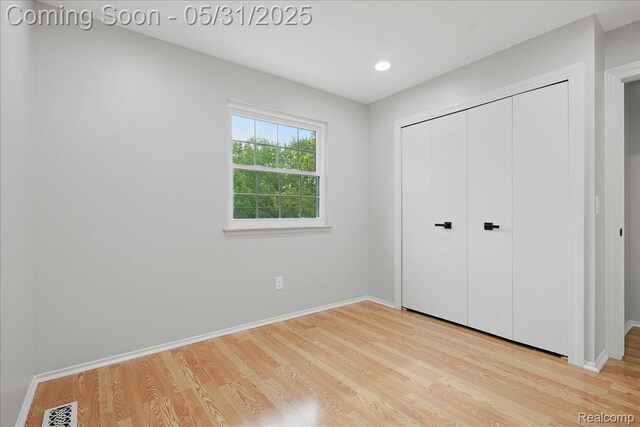 3004 Lansdowne Rd, Waterford, MI 48329 - unfurnished bedroom featuring wood finished floors, baseboards, a closet, and recessed lighting