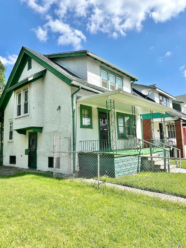 1956 Glendale St, Detroit, MI 48238 - view of front facade with covered porch and stucco siding