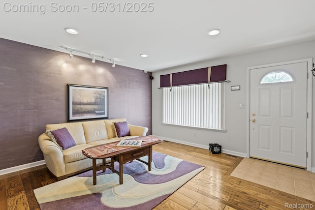 9220 Garden Ter, Commerce Twp, MI 48382 - living room with track lighting, baseboards, hardwood / wood-style flooring, and recessed lighting