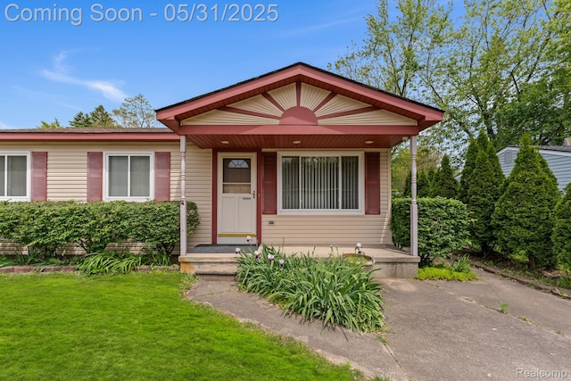 9220 Garden Ter, Commerce Twp, MI 48382 - view of front facade with a front lawn