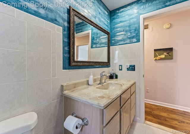 9220 Garden Ter, Commerce Twp, MI 48382 - bathroom with tile walls, vanity, and toilet