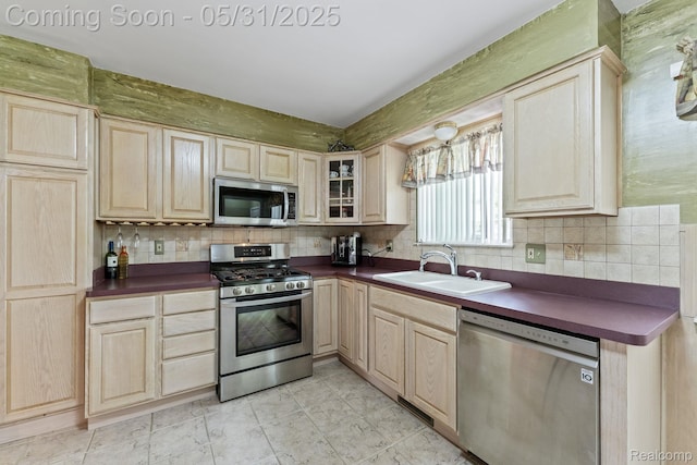 9220 Garden Ter, Commerce Twp, MI 48382 - kitchen featuring stainless steel appliances, light brown cabinetry, and dark countertops