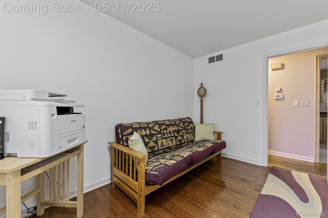 9220 Garden Ter, Commerce Twp, MI 48382 - living room with wood finished floors, baseboards, and vaulted ceiling