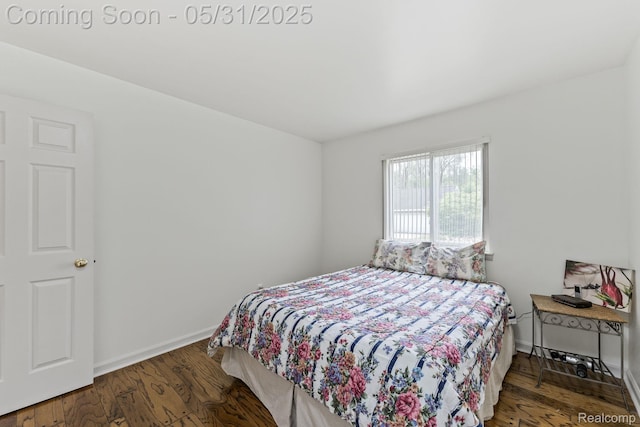 9220 Garden Ter, Commerce Twp, MI 48382 - bedroom featuring baseboards and wood finished floors