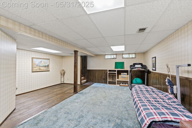 9220 Garden Ter, Commerce Twp, MI 48382 - bedroom with a drop ceiling, wood finished floors, wallpapered walls, wainscoting, and wooden walls
