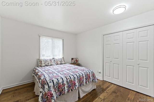 9220 Garden Ter, Commerce Twp, MI 48382 - bedroom with wood finished floors, a closet, and baseboards