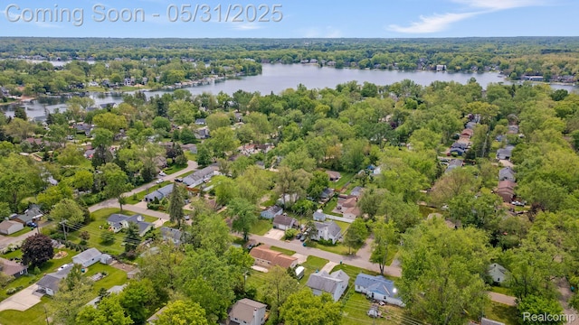9220 Garden Ter, Commerce Twp, MI 48382 - aerial view of property and surrounding area featuring a nearby body of water, nearby suburban area, and a heavily wooded area