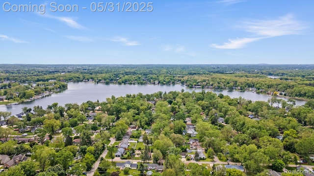 9220 Garden Ter, Commerce Twp, MI 48382 - aerial view of residential area with a nearby body of water and a forest