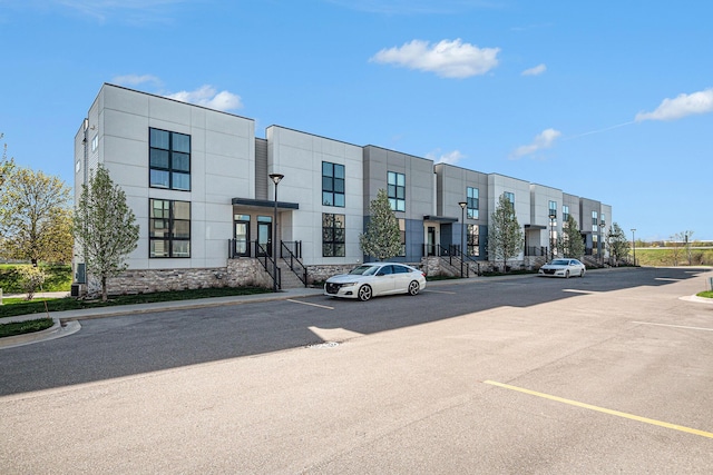 6016 Port View Dr SE, Grand Rapids, MI 49512 - view of building exterior with uncovered parking