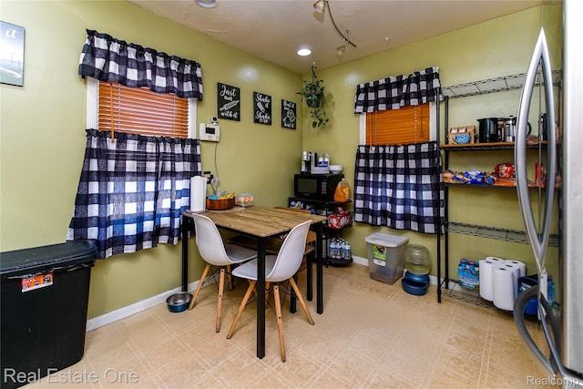 540 Champaign Rd, Lincoln Park, MI 48146 - dining area featuring baseboards and tile patterned floors