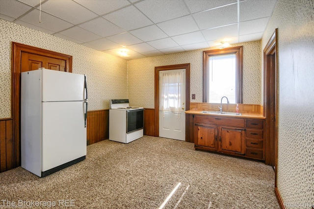 9425 W Saginaw Rd, Richville, MI 48758 - kitchen with white appliances, a sink, wainscoting, wallpapered walls, and a paneled ceiling
