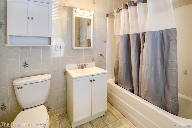 9425 W Saginaw Rd, Richville, MI 48758 - bathroom with vanity, shower / bath combination with curtain, tile walls, toilet, and tile patterned flooring