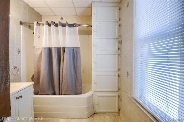 9425 W Saginaw Rd, Richville, MI 48758 - bathroom featuring tile walls, shower / bath combination with curtain, vanity, and tile patterned floors