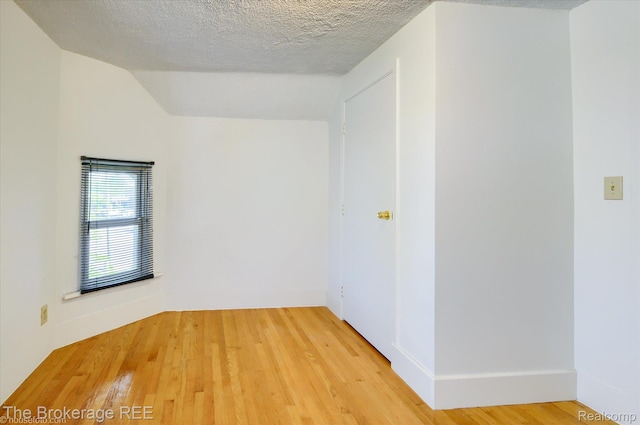 9425 W Saginaw Rd, Richville, MI 48758 - unfurnished room featuring light wood finished floors and a textured ceiling