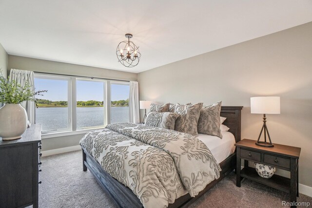 6652 Westminister St, Fenton, MI 48430 - bedroom featuring carpet, baseboards, a water view, and a chandelier
