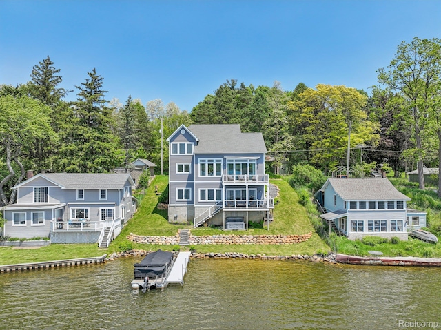 6652 Westminister St, Fenton, MI 48430 - rear view of house featuring stairway, boat lift, a balcony, and a deck with water view