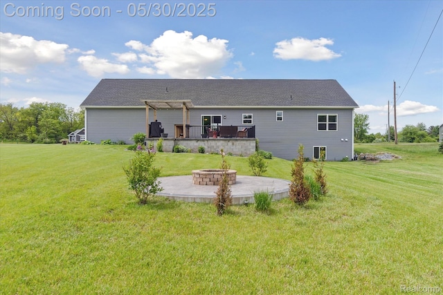 4925 Toratola Ln, Howell, MI 48843 - rear view of property with a fire pit, a pergola, a patio, a wooden deck, and a lawn