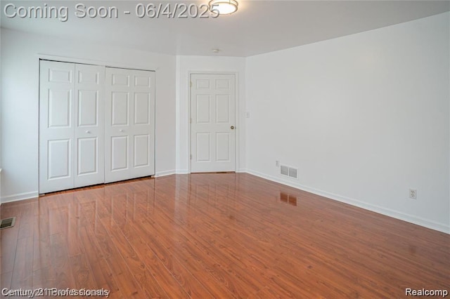 23060 Berdeno Ave, Hazel Park, MI 48030 - unfurnished bedroom with wood finished floors, a closet, and baseboards
