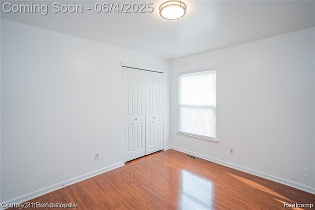 23060 Berdeno Ave, Hazel Park, MI 48030 - unfurnished bedroom featuring wood finished floors, a closet, and baseboards