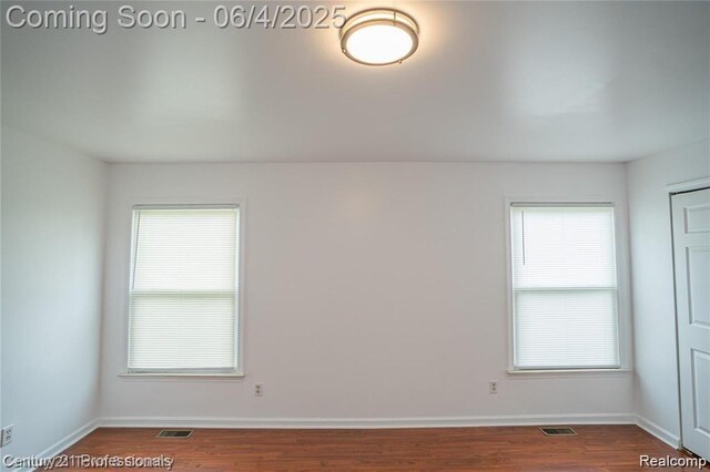 23060 Berdeno Ave, Hazel Park, MI 48030 - unfurnished room with dark wood finished floors and baseboards