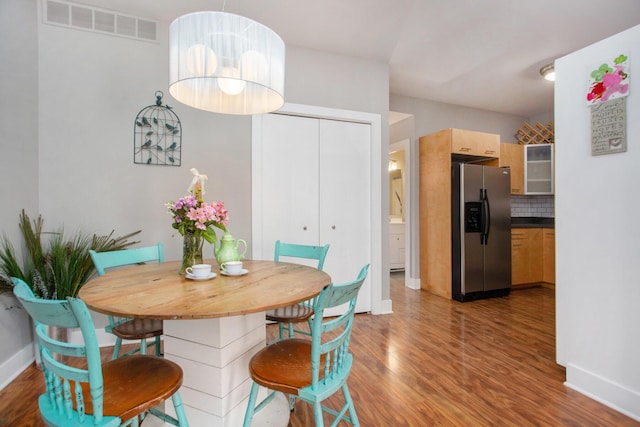 2159 New Town Dr NE, Grand Rapids, MI 49525 - dining area with wood finished floors and baseboards