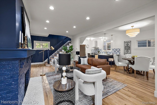 16514 Wildemere St, Detroit, MI 48221 - living area featuring ornamental molding, stairway, light wood-type flooring, recessed lighting, and baseboards