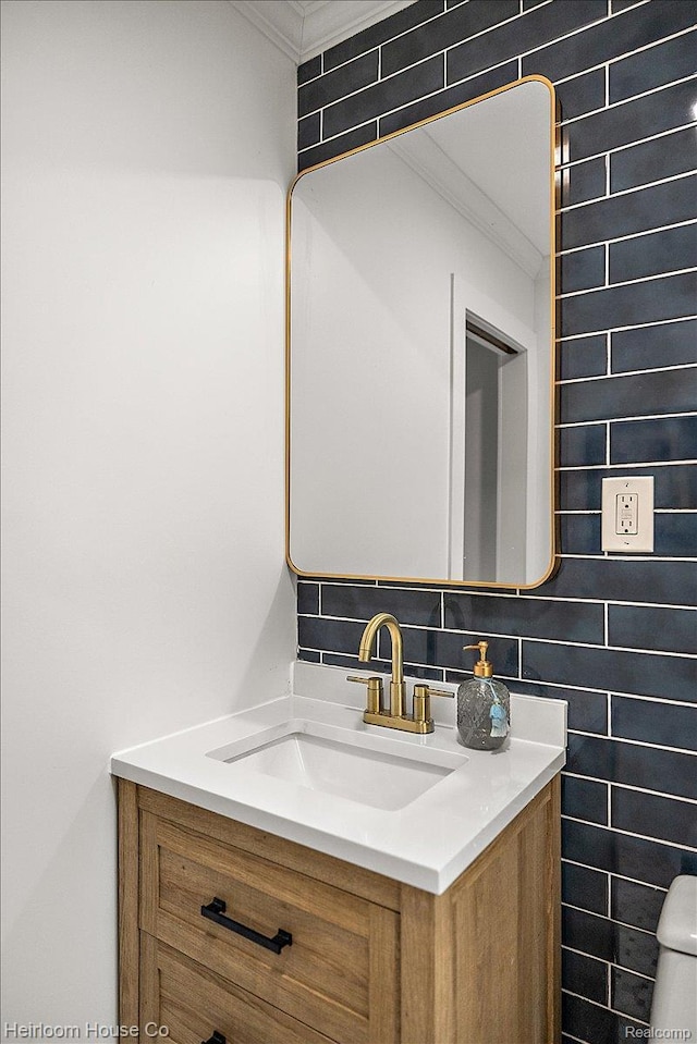 16514 Wildemere St, Detroit, MI 48221 - half bathroom with vanity, crown molding, and toilet