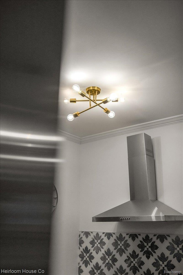 16514 Wildemere St, Detroit, MI 48221 - detailed view of wall chimney range hood, a chandelier, and crown molding