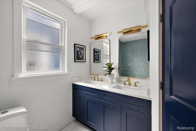 16514 Wildemere St, Detroit, MI 48221 - full bathroom with double vanity, toilet, and baseboards
