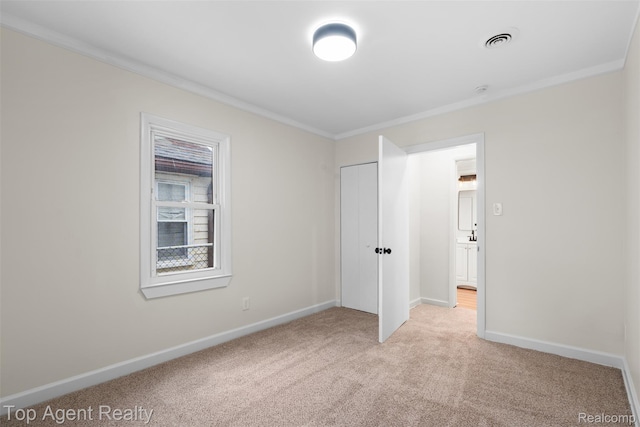 26041 Belanger St, Rochester, MI 48066 - unfurnished bedroom featuring crown molding, light colored carpet, baseboards, and a closet